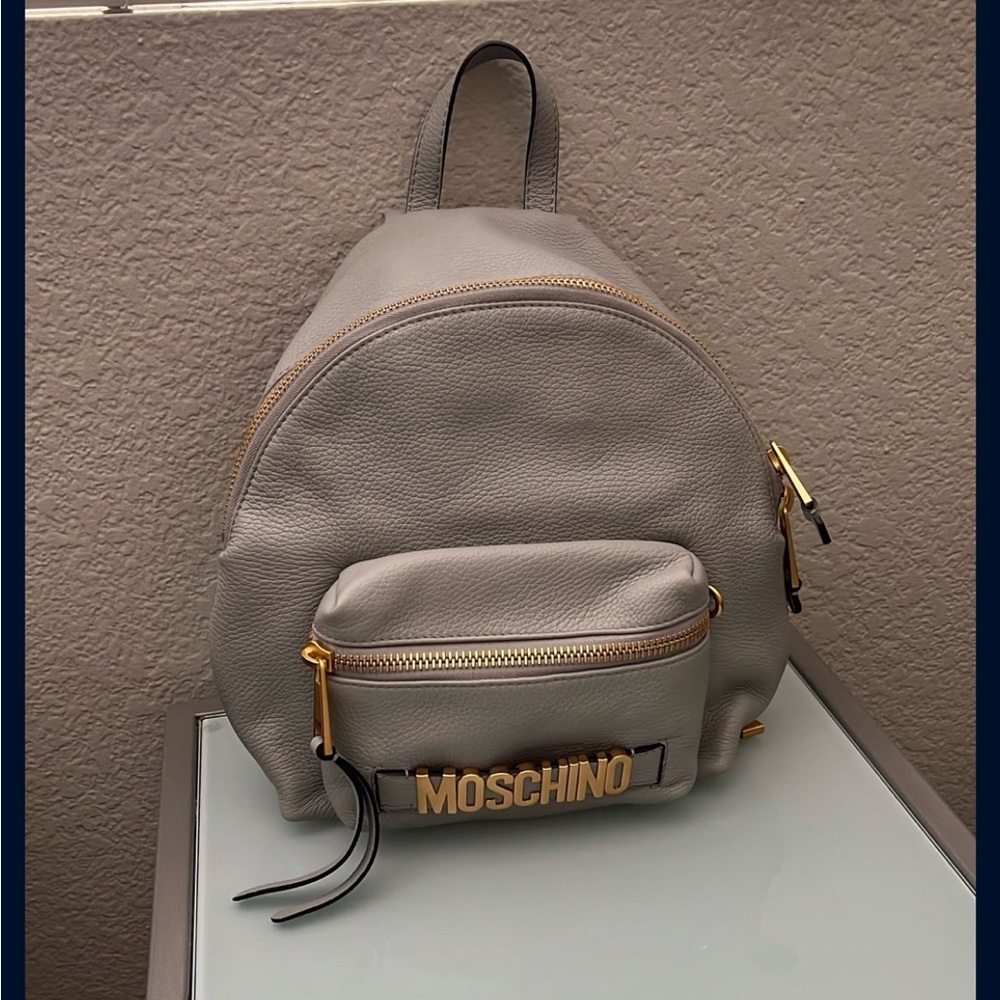 Moschino Black and Gray Interior with Gold Logo